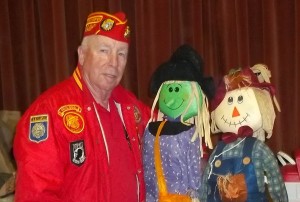 Joe Shea with two scare crows Craft Fair 2015
