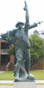The term "Iron Mike" is uniquely American slang used to refer to men who are especially tough, brave, and inspiring. Because the use of the slang term was popular in the first half of the 20th century, many statues from that period acquired the Iron Mike nickname, and over the generations the artists' titles were largely forgotten. Parris Island's Iron Mike is depicted carrying a Maxim machine gun over his right shoulder and an M1911 pistol in his raised left hand, created as a memorial to all of the Parris Island graduates who were killed during WWI.[https://en.wikipedia.org/wiki/Iron_Mike]